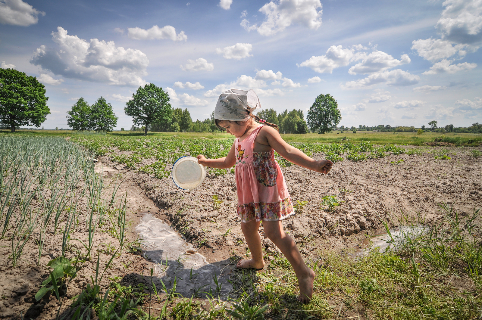 A young girl plays on her grandparents small farm near the border of the Exclusion Zone in Ukraine.