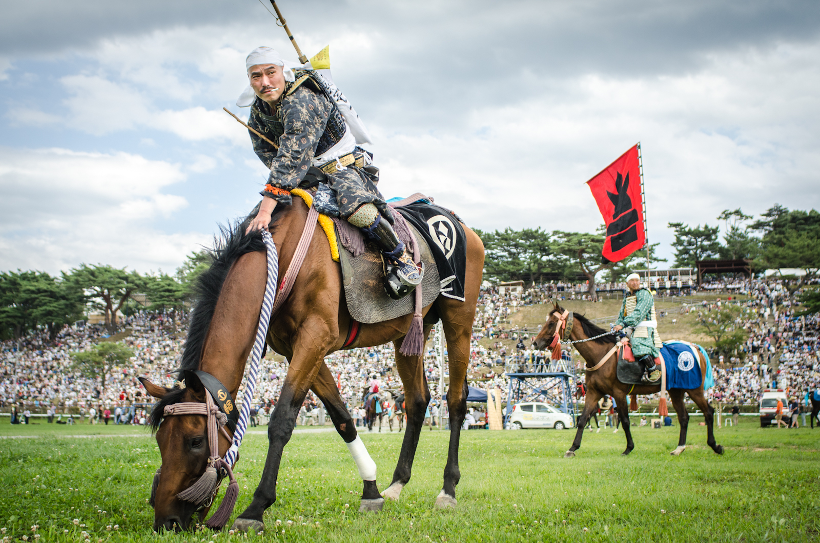 Samurai warriors wait on their horses before competing in traditional games